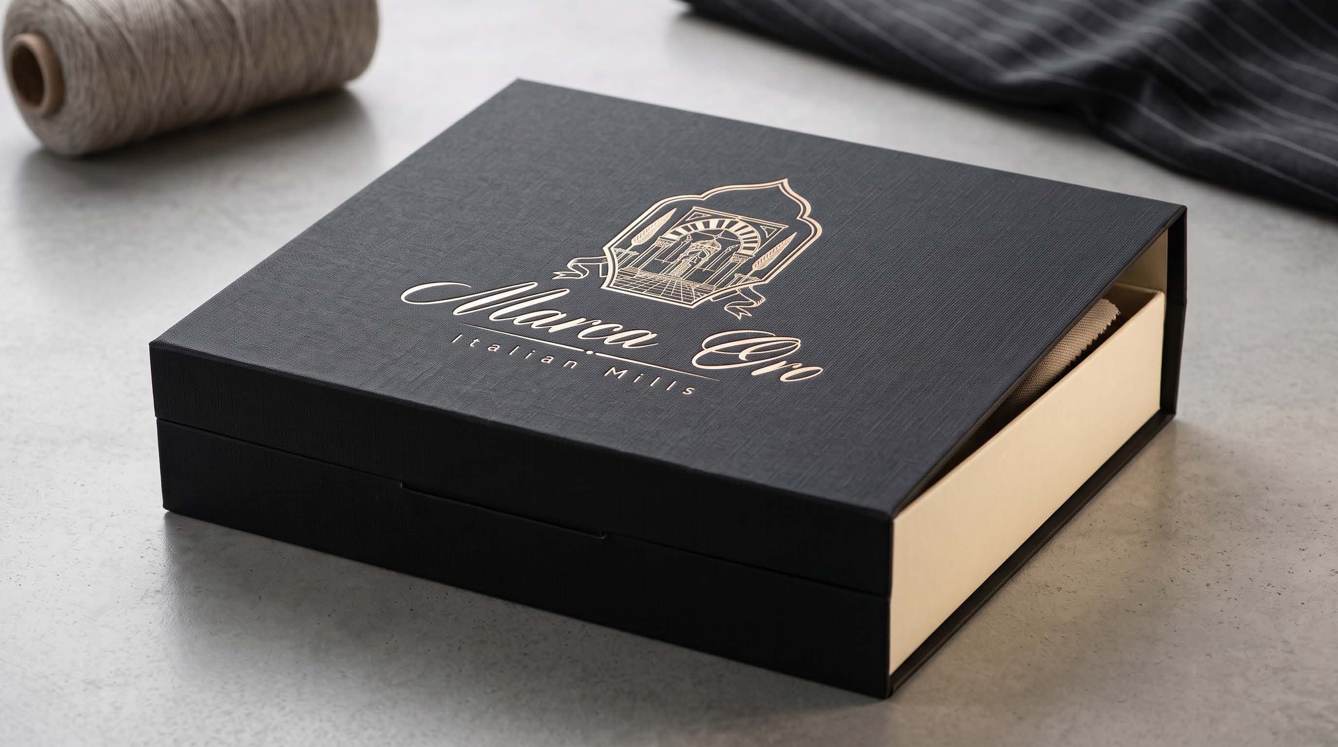 A Marca Oro presentation box in black linen
